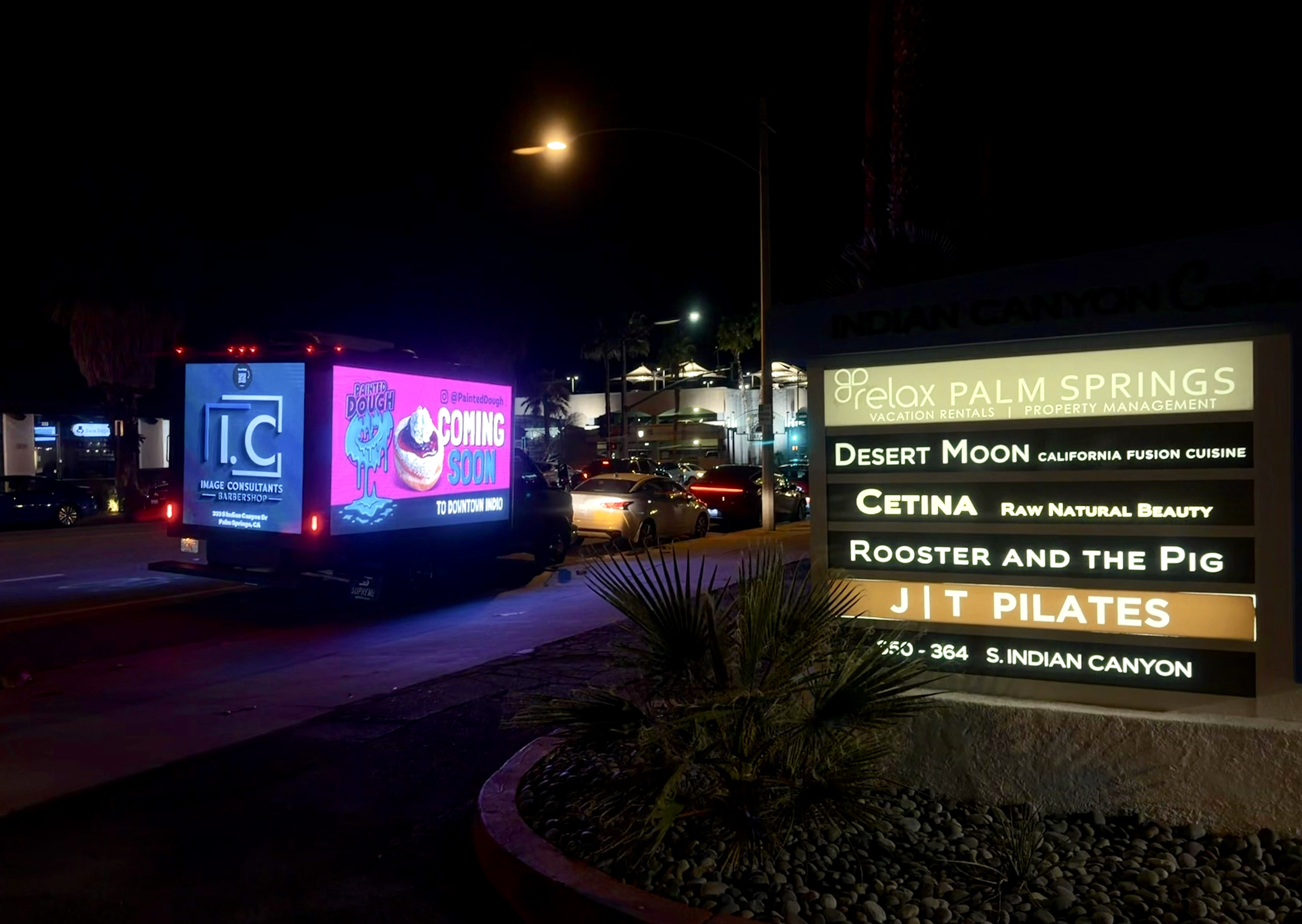 LED billboard truck driving at night