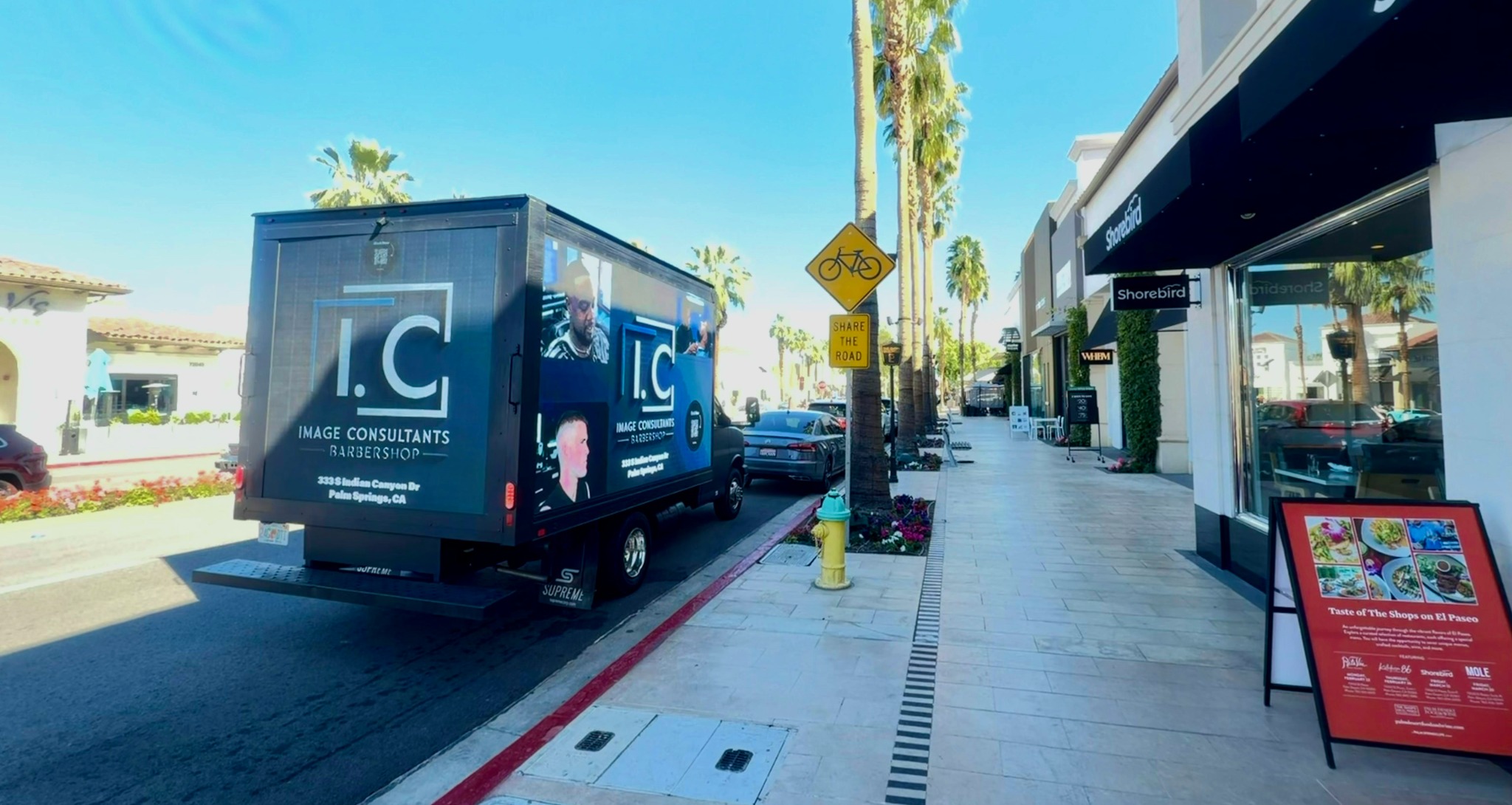 BrightPath mobile LED vehicle beside storefronts in an active commercial setting